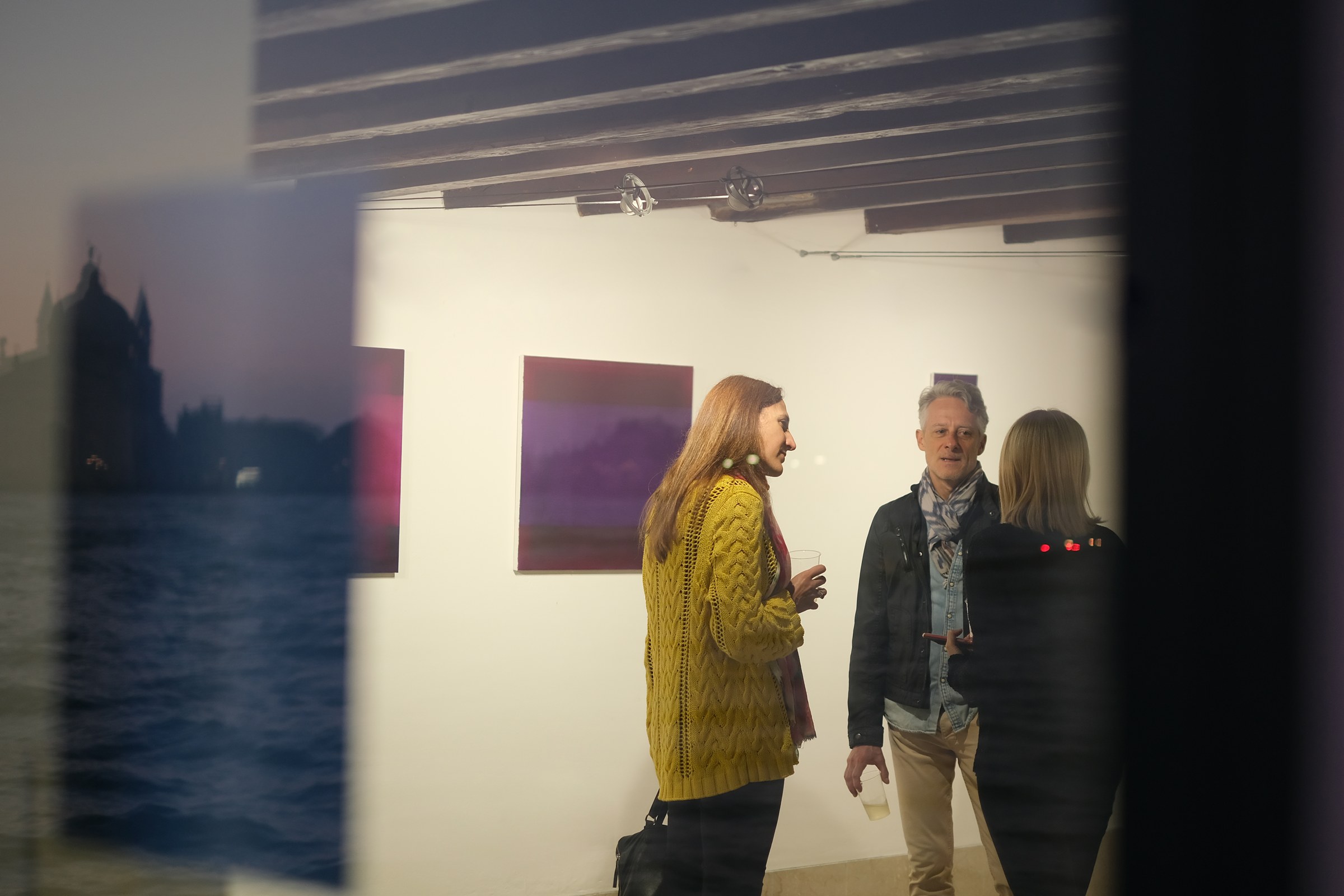 Opening reception viewed through the gallery window